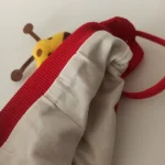 کلاه تک نوزادی تریکو بند دار گرم مدل عروسکی3 - تصویر 5